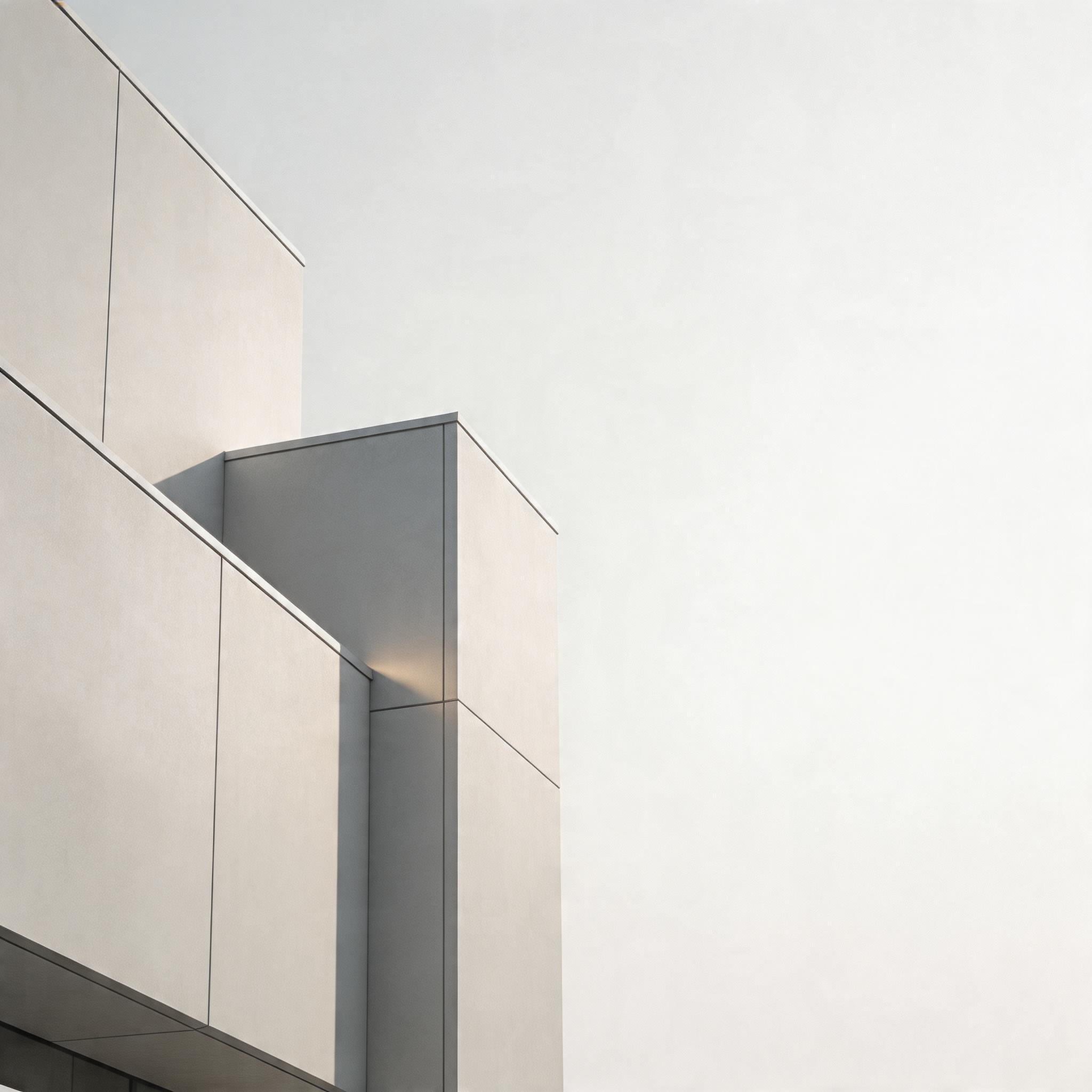 Minimal, abstract architectural background featuring clean geometric lines, soft shadows, and modern building materials. Light grey and white tones, subtle depth, no identifiable location, no people. Emphasis on structure, precision, and engineered surfaces. High‑end corporate aesthetic, suitable for a facilities and engineering brochure. Ultra‑clean, minimal, with gentle contrast and plenty of negative space for text overlay.