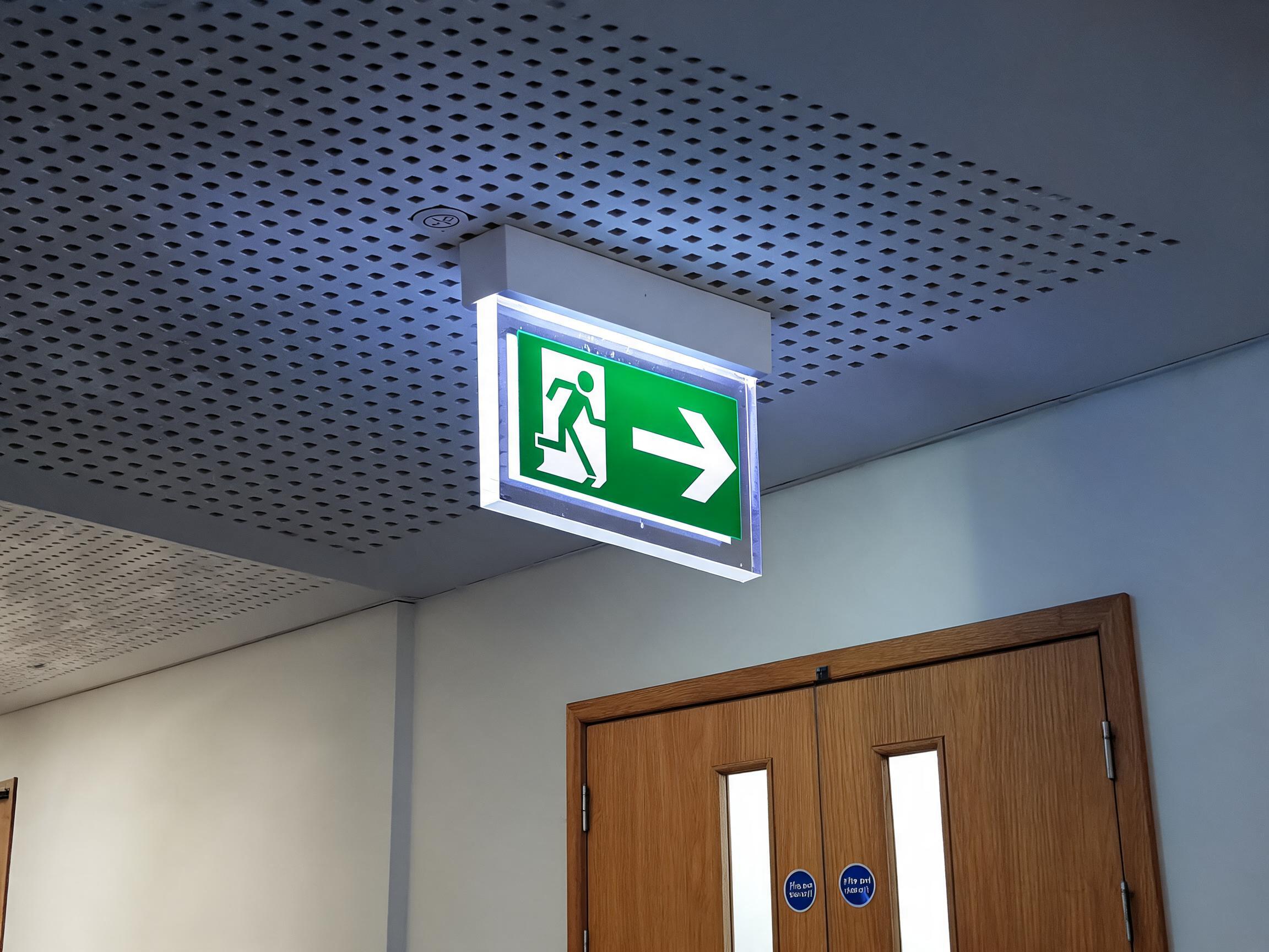 The reference images are all fire doors. create an image of a fire door in a corridor. use the same perspective as in image006