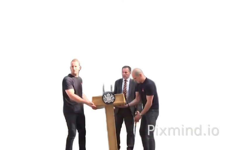 Extracting the podium as its own layer is the top priority. Carefully extract it from the rest of the image, including the hands holding it and the man standing behind it.